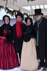 Costumed Victorian Carolers Strolling Main Street